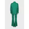 Suit with a silk blouse with a tag