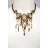 Necklace with metal feathers and eagle heads