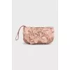 Textile clutch with a flower