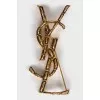 Golden relief brooch