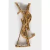 Golden relief brooch