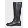 Black leather boots with branded embossing