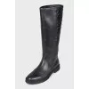 Black leather boots with branded embossing