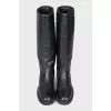 Black leather boots with branded embossing