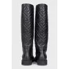 Black leather boots with branded embossing
