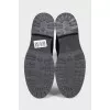 Black leather boots with branded embossing