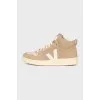 High-top beige suede sneakers