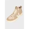 High-top beige suede sneakers
