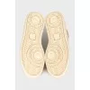 High-top beige suede sneakers