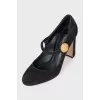 Suede shoes with a gold logo