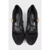 Suede shoes with a gold logo