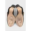 Suede shoes with a gold logo