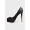 Black suede shoes decorated with rhinestones