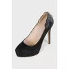 Black suede shoes decorated with rhinestones