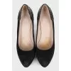 Black suede shoes decorated with rhinestones