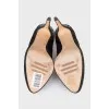 Black suede shoes decorated with rhinestones