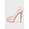 Patent leather shoes with decorated heels