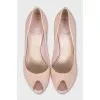Patent leather shoes with decorated heels