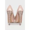 Patent leather shoes with decorated heels
