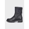 Black leather boots with a zipper