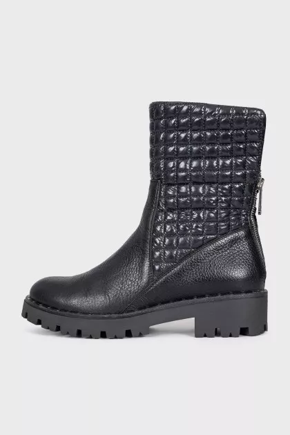 Black leather boots with a zipper
