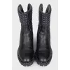 Black leather boots with a zipper