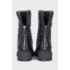Black leather boots with a zipper