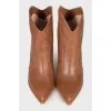 Brown pointed-toe Cossack boots