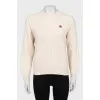 Beige sweater with brand logo