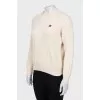 Beige sweater with brand logo
