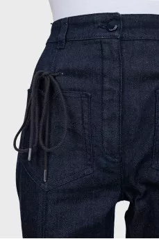 Flared jeans decorated with lacing