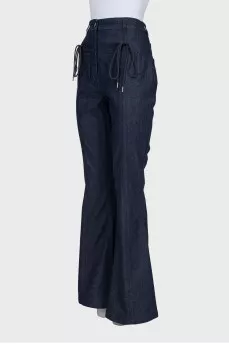 Flared jeans decorated with lacing
