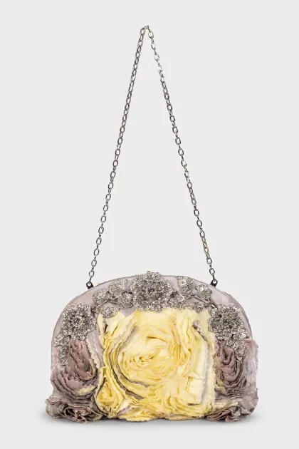 The textile bag is decorated with flowers