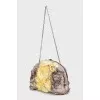 The textile bag is decorated with flowers