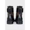 Leather boots in the signature Wonderland print
