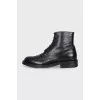 Black boots with perforations
