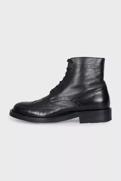 Black boots with perforations