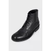 Black boots with perforations