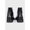 Black boots with perforations