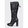 Black leather boots with a zipper