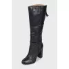 Black leather boots with a zipper