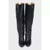 Black leather boots with a zipper