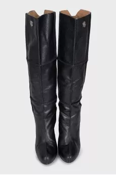Black leather boots with a zipper