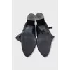 Black leather boots with a zipper