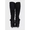 Black suede boots with a bow