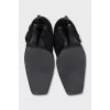 Black suede boots with a bow