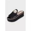 Leather flip-flops with a gold logo