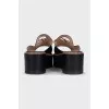 Leather flip-flops with a gold logo