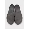 Leather flip-flops with a gold logo