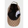 Men's textile cap with a signature print